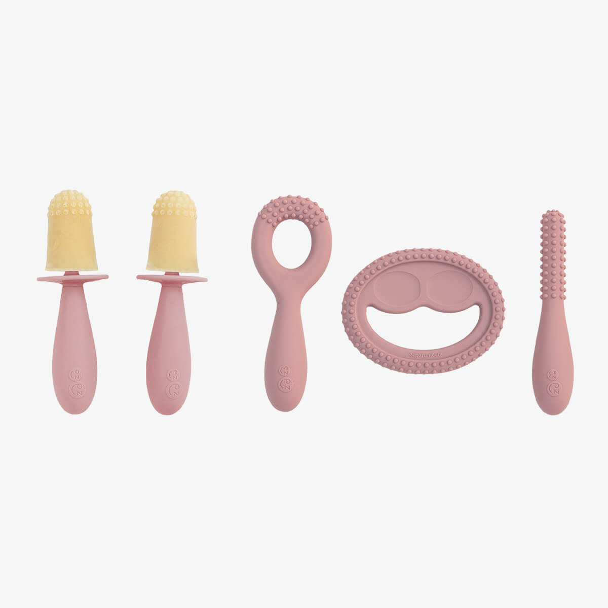 Pre-feeding set by ezpz in blush pink includes the tiny pops and oral development tools (silicone teethers)