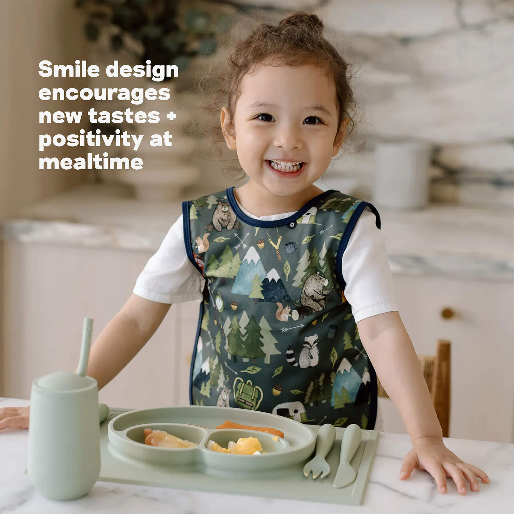 ezpz Happy Mat has a smile design that encourages new tastes and positivity at mealtme