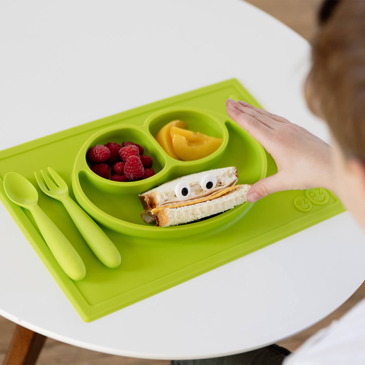 Happy Mat in Lime by ezpz / The Original All-In-One Silicone Plates & Placemats that Stick to the Table