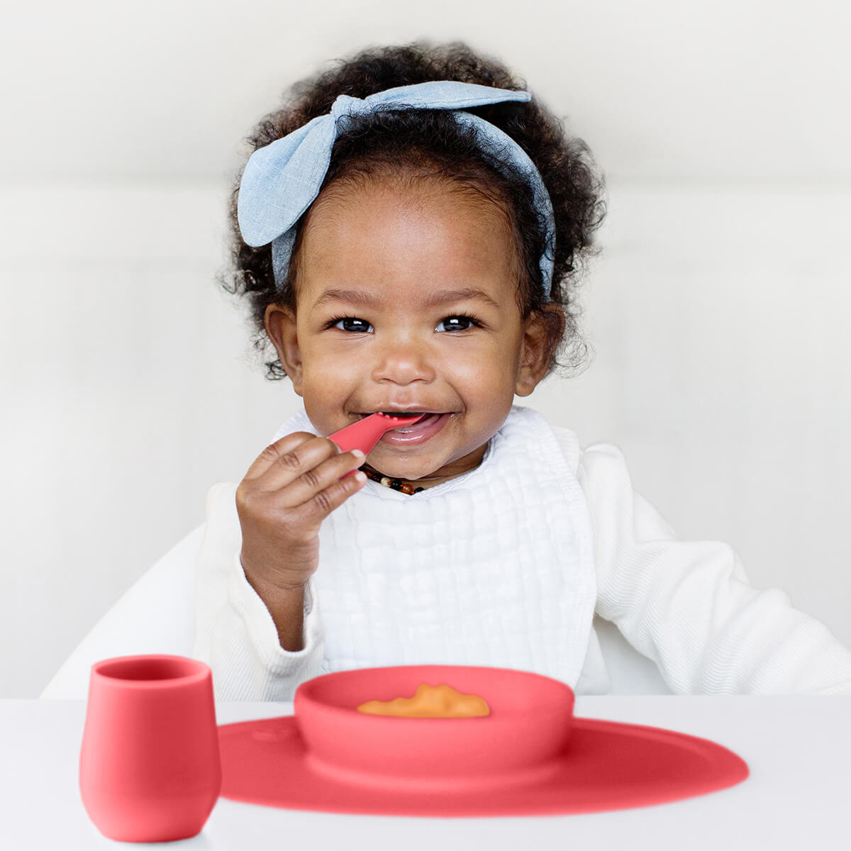 First Foods Set in Coral by ezpz / The Original All-In-One Silicone Plates & Placemats that Stick to the Table