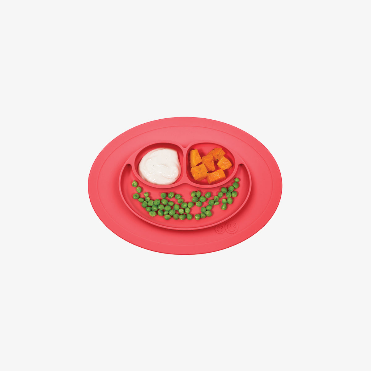 The Mini Mat in Coral by ezpz / Self-Suctioning Silicone Plate + Placemat
