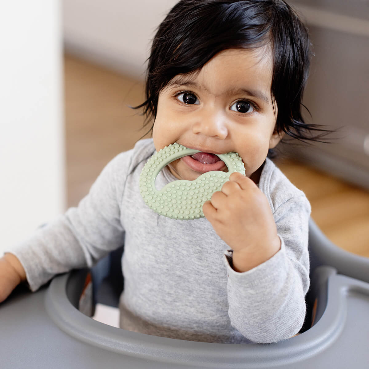 Pre-feeding set by ezpz in sage green includes the tiny pops and oral development tools (silicone teethers)