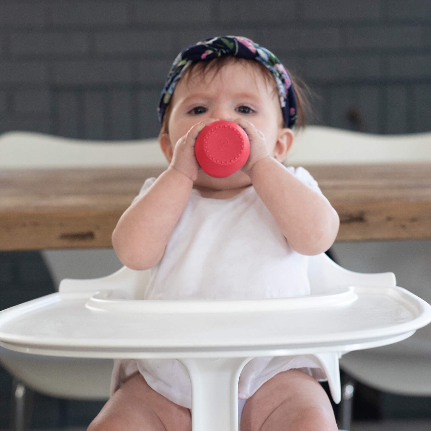 The Tiny Cup in Coral by ezpz / Open-Top, Silicone Drinking Cup for Babies