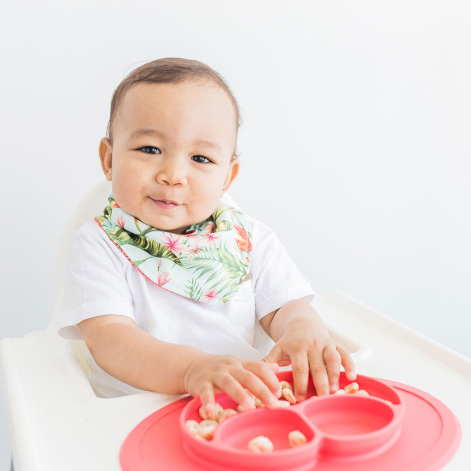 The Mini Mat in Coral by ezpz / Self-Suctioning Silicone Plate + Placemat