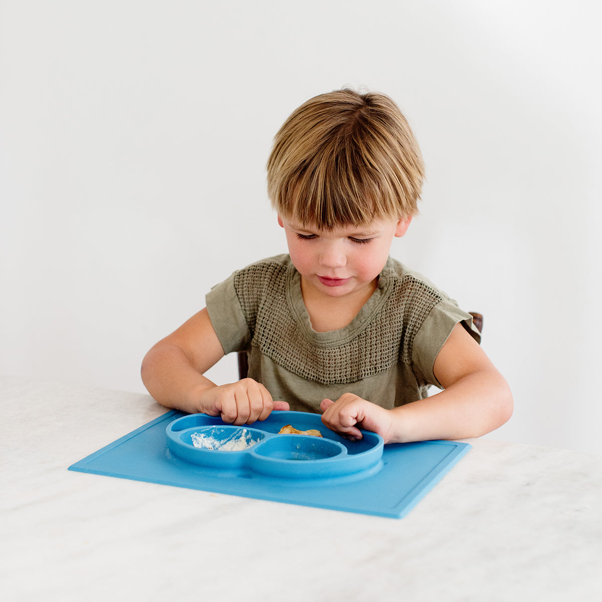Happy Mat in Blue by ezpz / The Original All-In-One Silicone Plates & Placemats that Stick to the Table