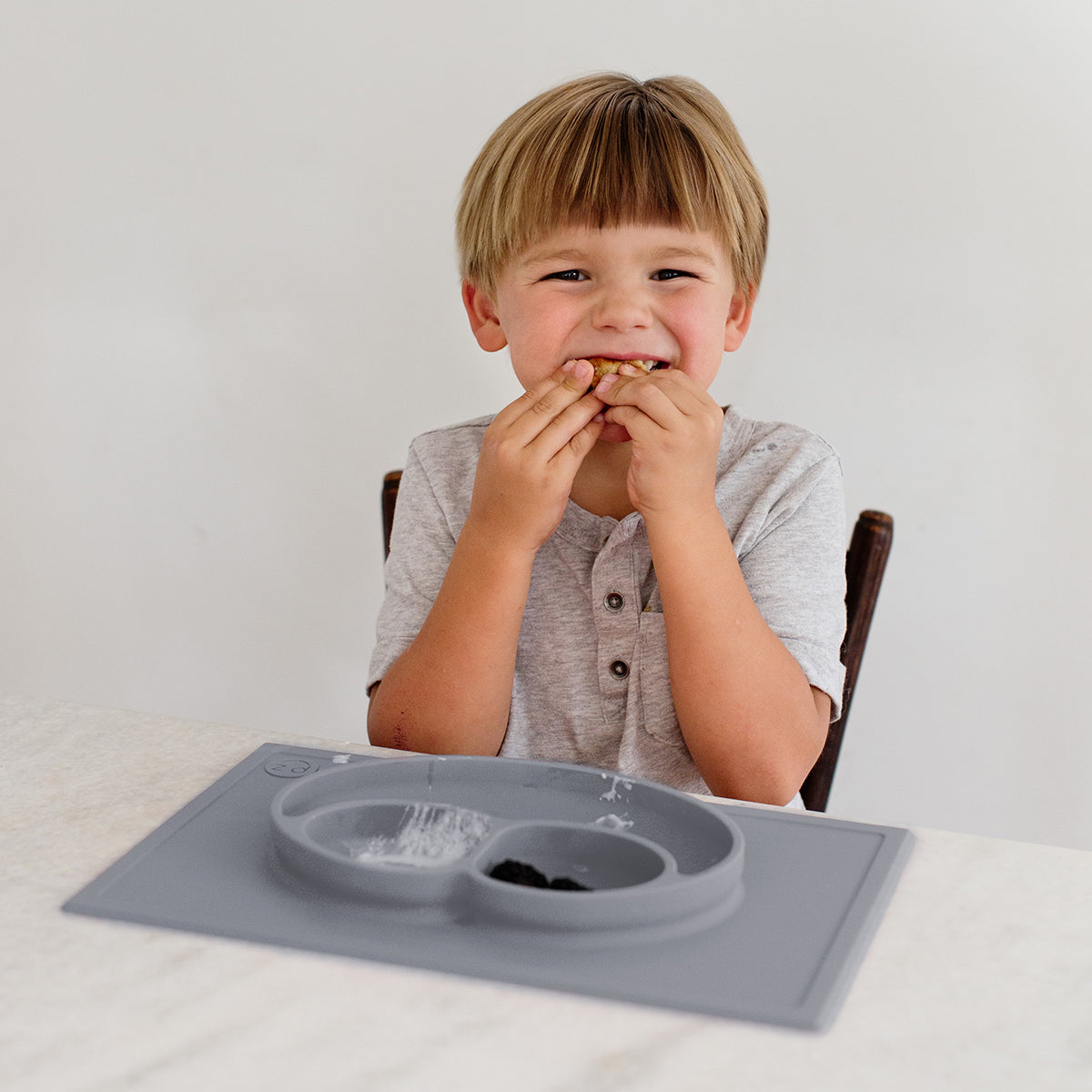 Happy Mat in Gray by ezpz / The Original All-In-One Silicone Plates & Placemats that Stick to the Table