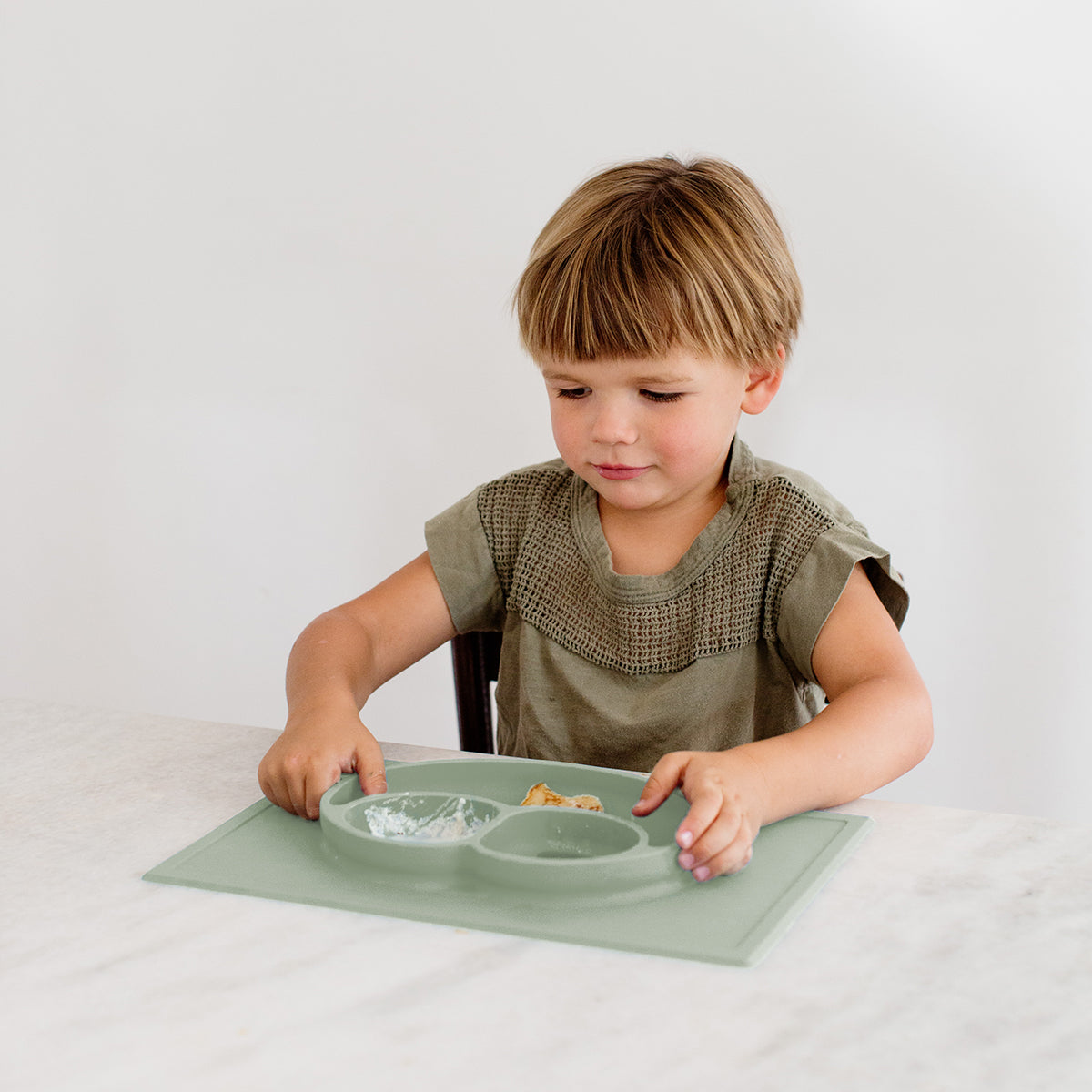 Happy Mat in Sage by ezpz / The Original All-In-One Silicone Plates & Placemats that Stick to the Table
