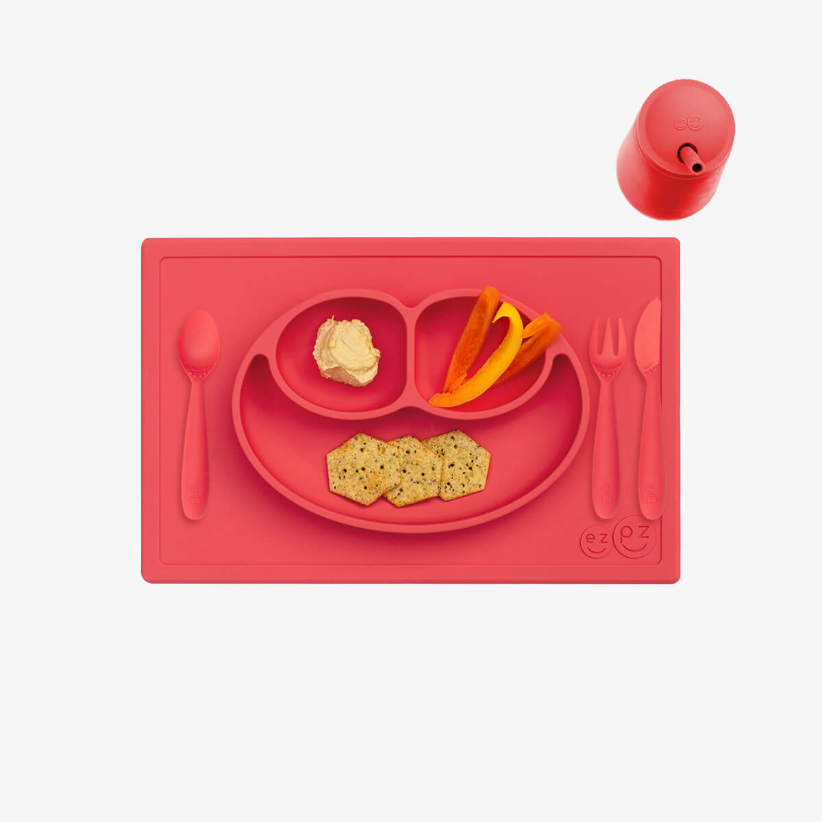 ezpz Happy Feeding Set in Coral / Silicone, Self-Suctioning Plate, Silicone Cup and Straw, Training Utensils for Toddlers