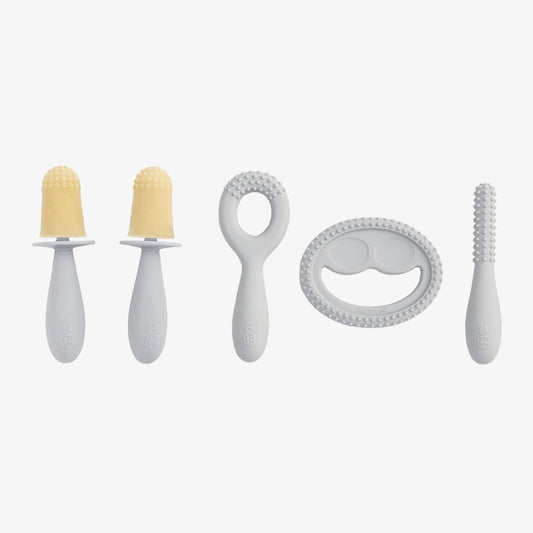 Pre-feeding set by ezpz in pewter light gray includes the tiny pops and oral development tools (silicone teethers)