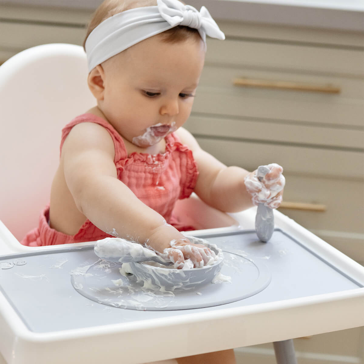 The Tiny Placemat in Pewter is a non-slip, silicone placemat that fits on most highchair trays