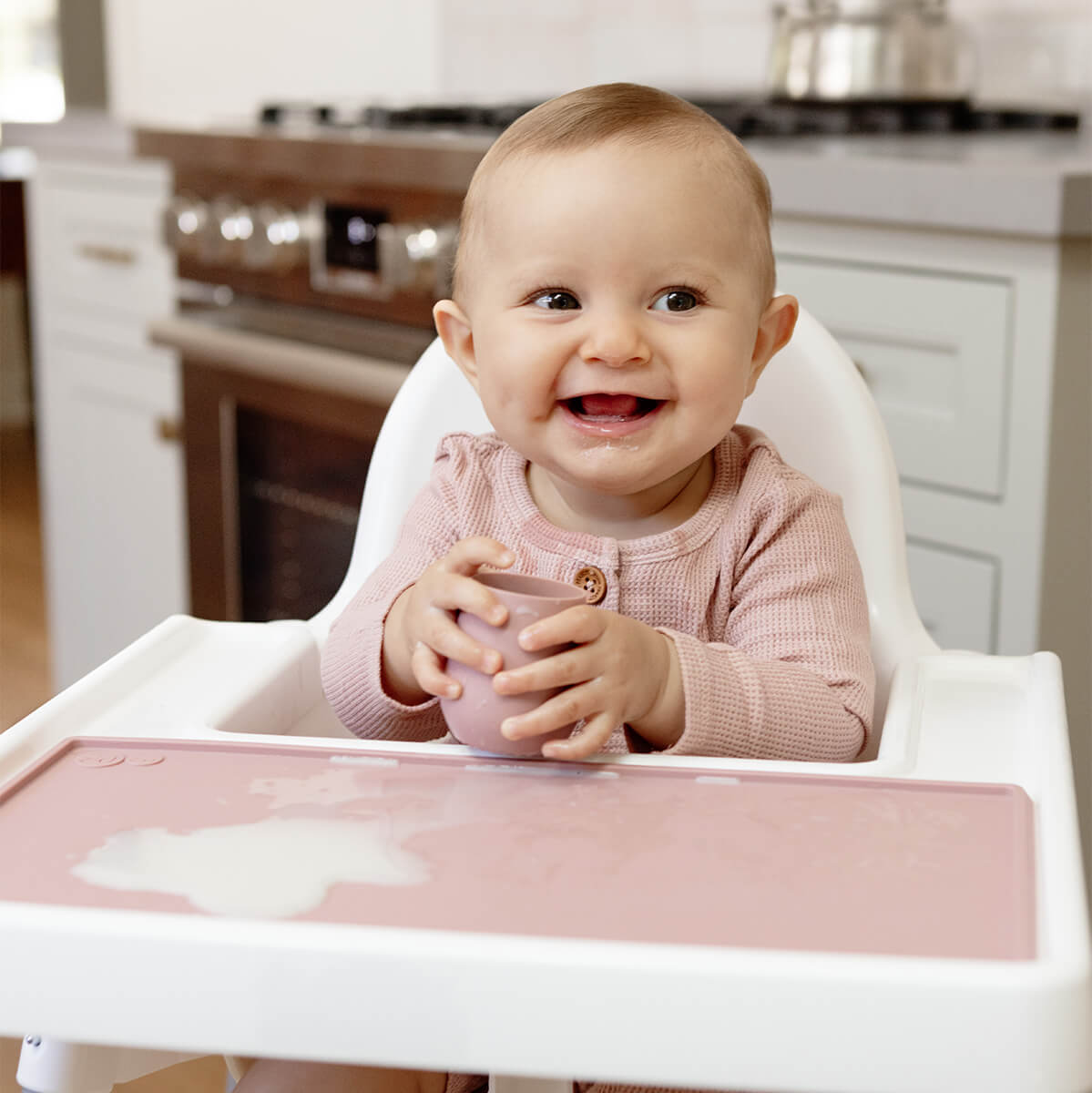 The Tiny Placemat in Blush is a non-slip, silicone placemat that fits on most highchair trays