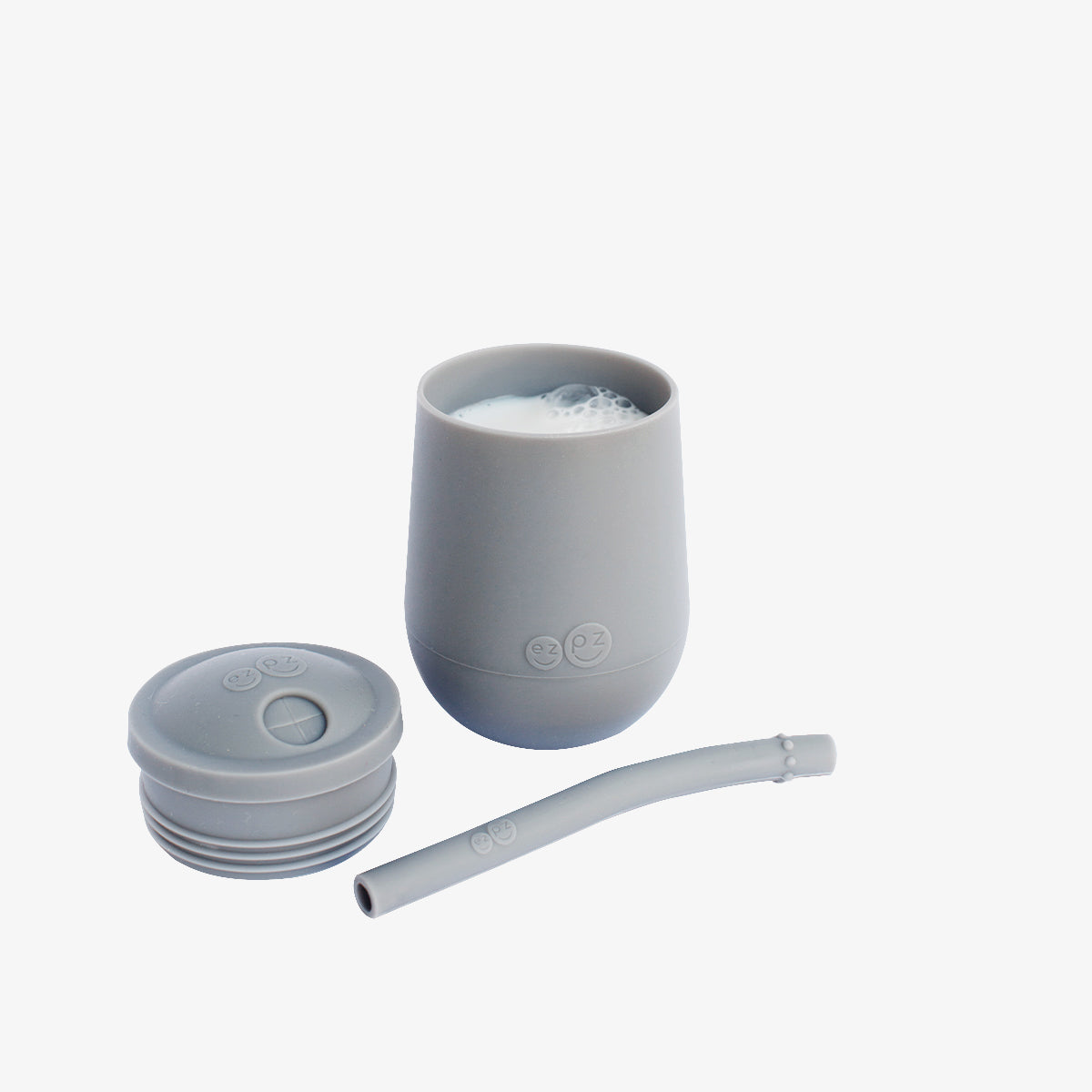 The Mini Cup + Straw in Gray by ezpz / Silicone Drinking Cup and Straw Training System for Toddlers